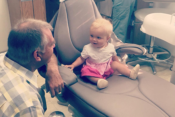 Dr. Bob with his granddaughter